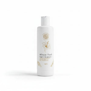 a white bottle of Hibiscus Thaali hair cleanser