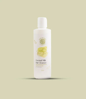 a white bottle of coconut milk hair cleanser