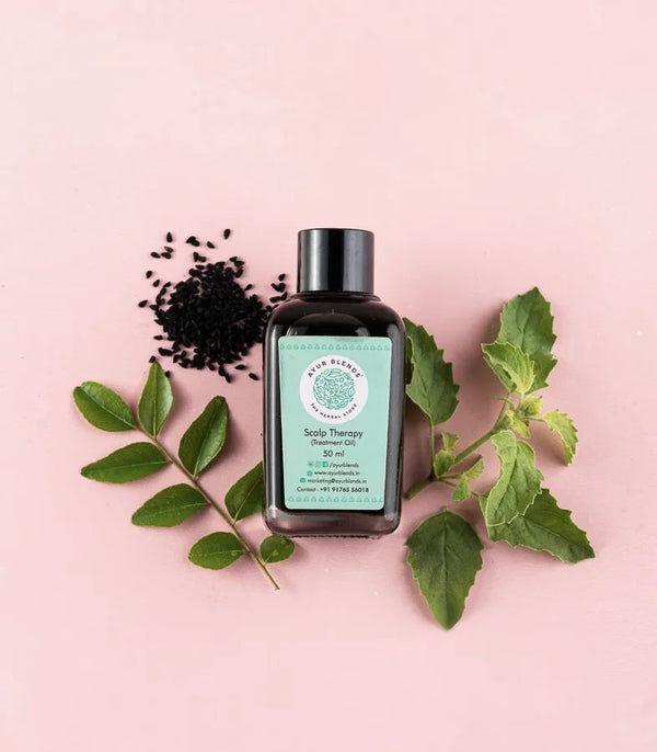 Intense scalp therapy oil, surrounded by ingredients: tulsi, gaurava leaves & Kayyonni seeds