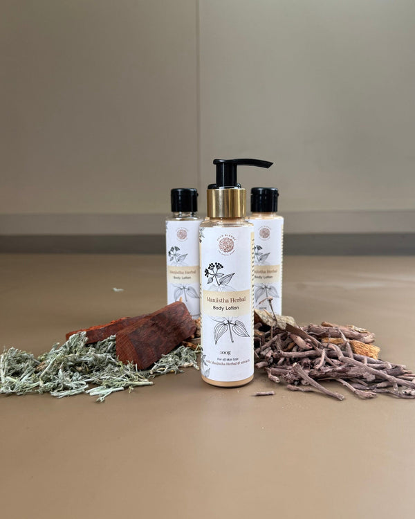 Manjistha herbal body lotion bottle surrounded with ingredients 