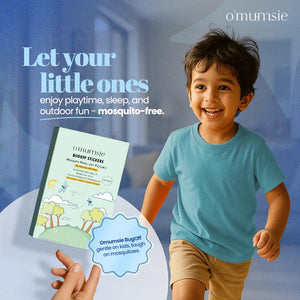 Smiling boy running outdoors beside O'mumsie BugOff Stickers box